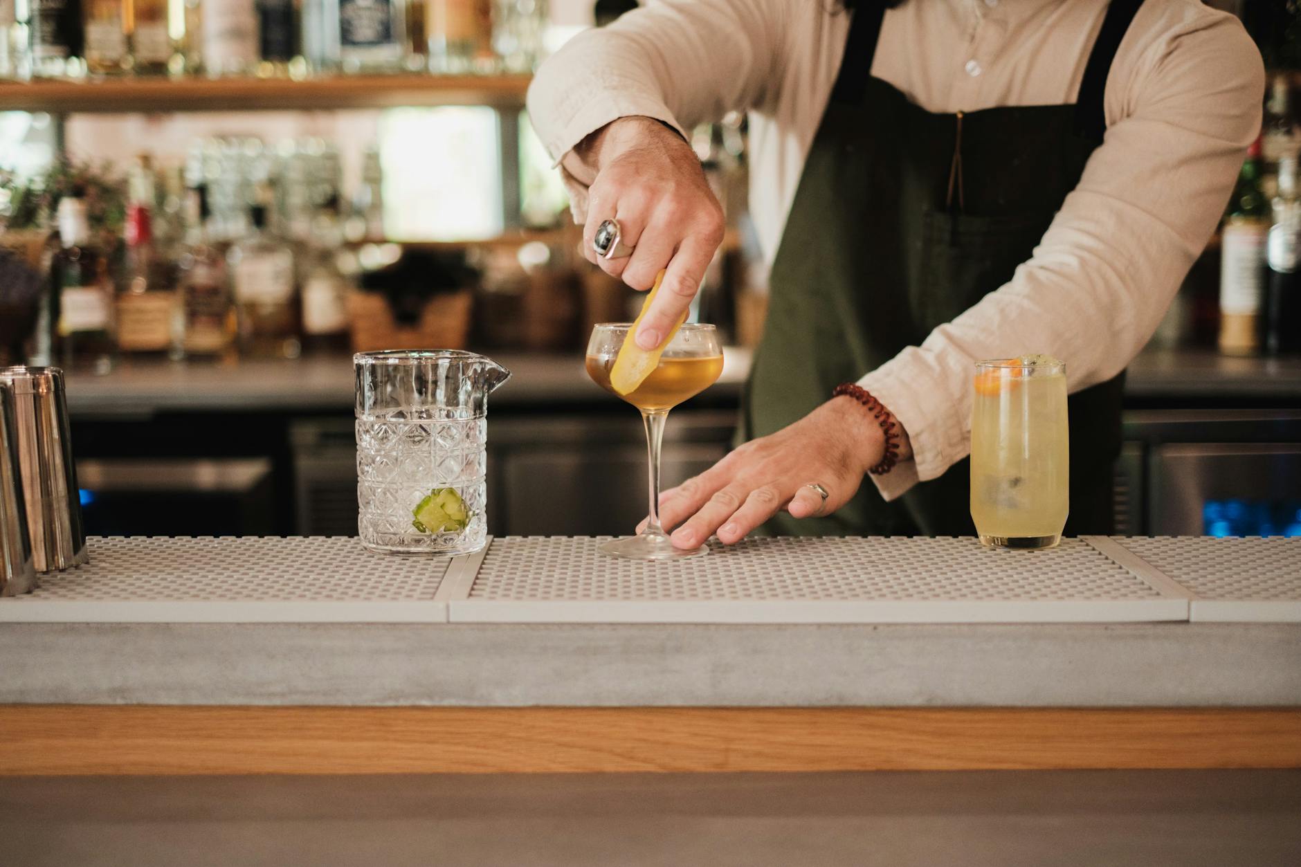 Craft cocktail being prepared at a Stockholm bar counter