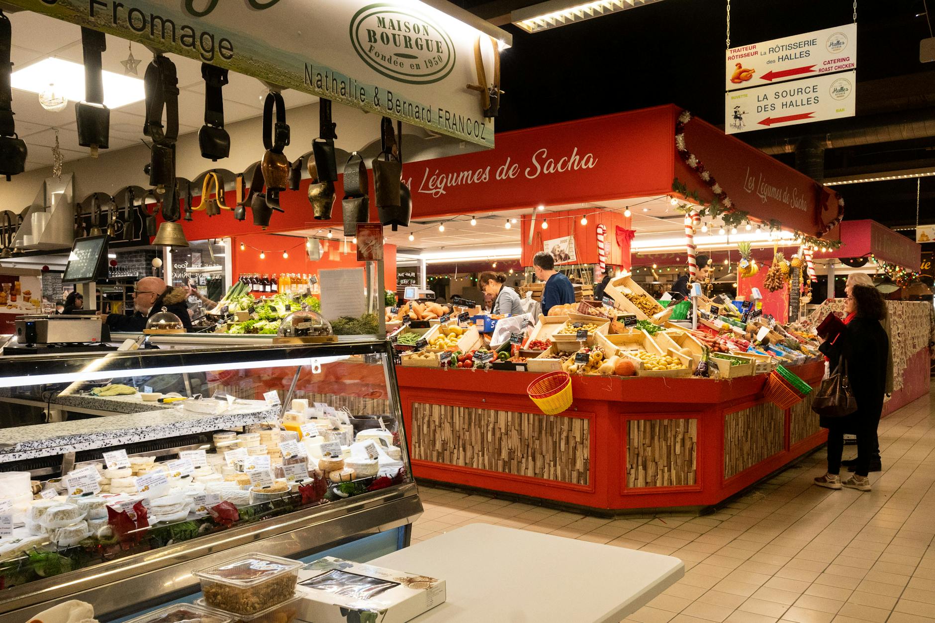 Busy indoor food market hall with vendors and fresh produce