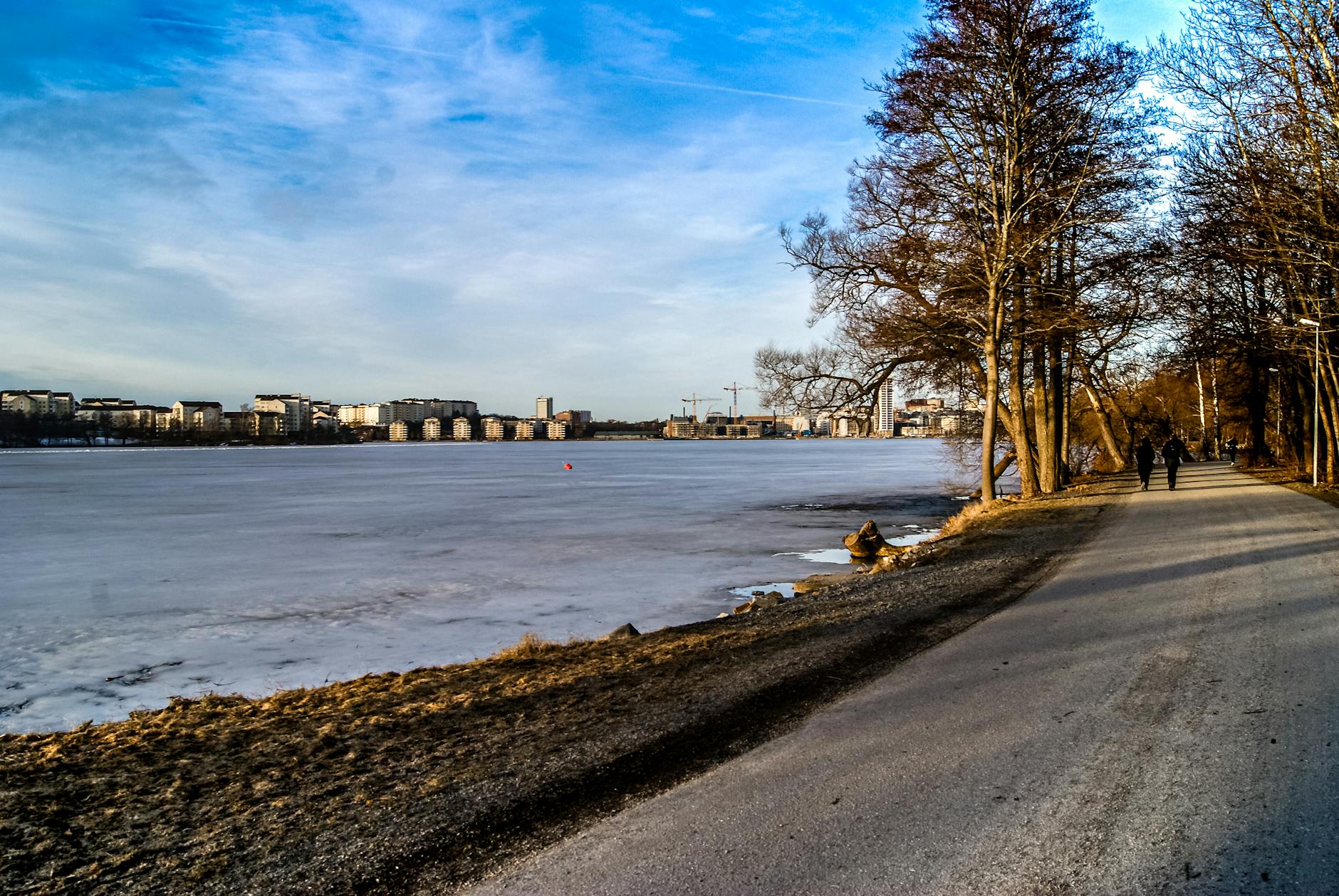 Free things to do in Stockholm — locals walking through a city park