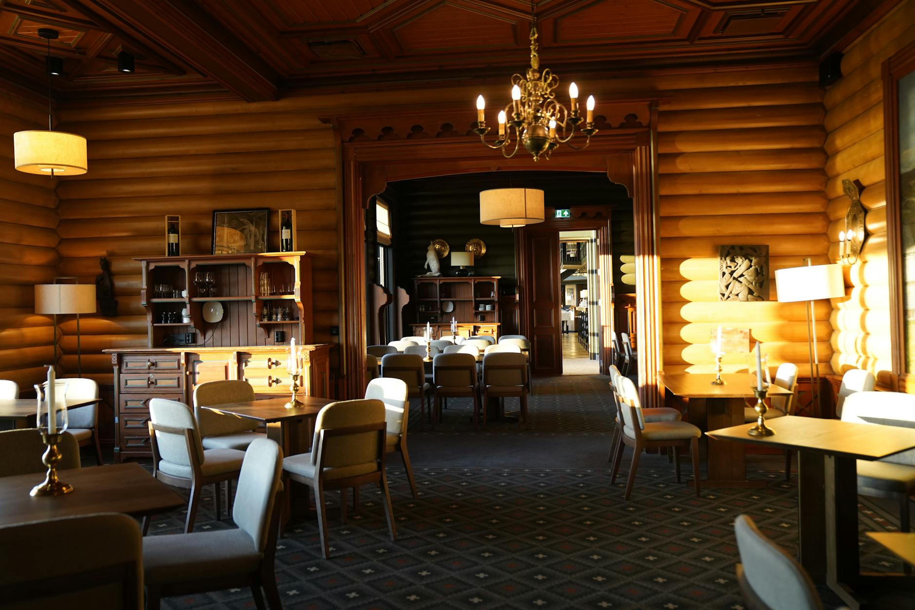 Elegant hotel restaurant interior with set tables and design lighting