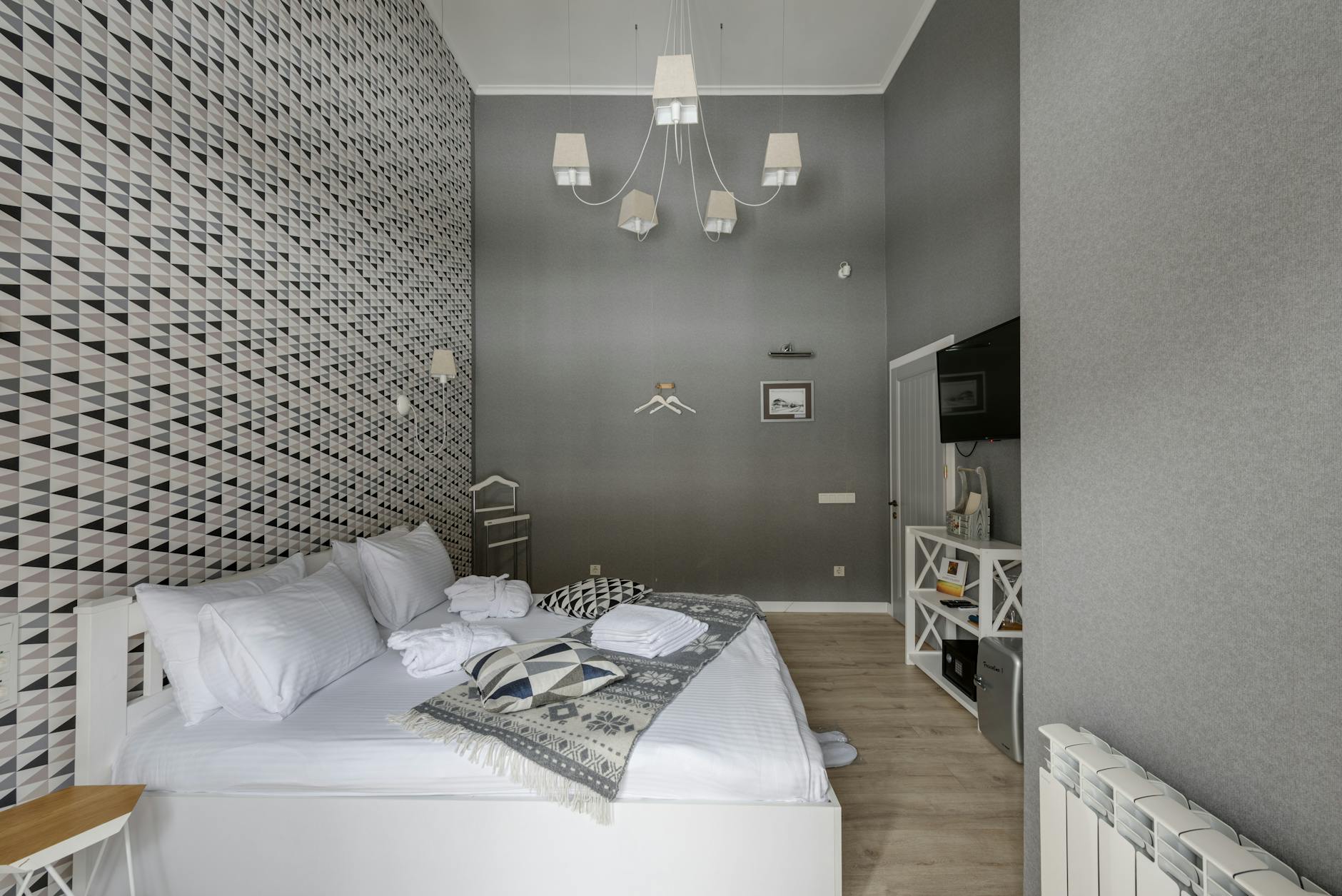 Small boutique Scandinavian hotel bedroom with design furniture