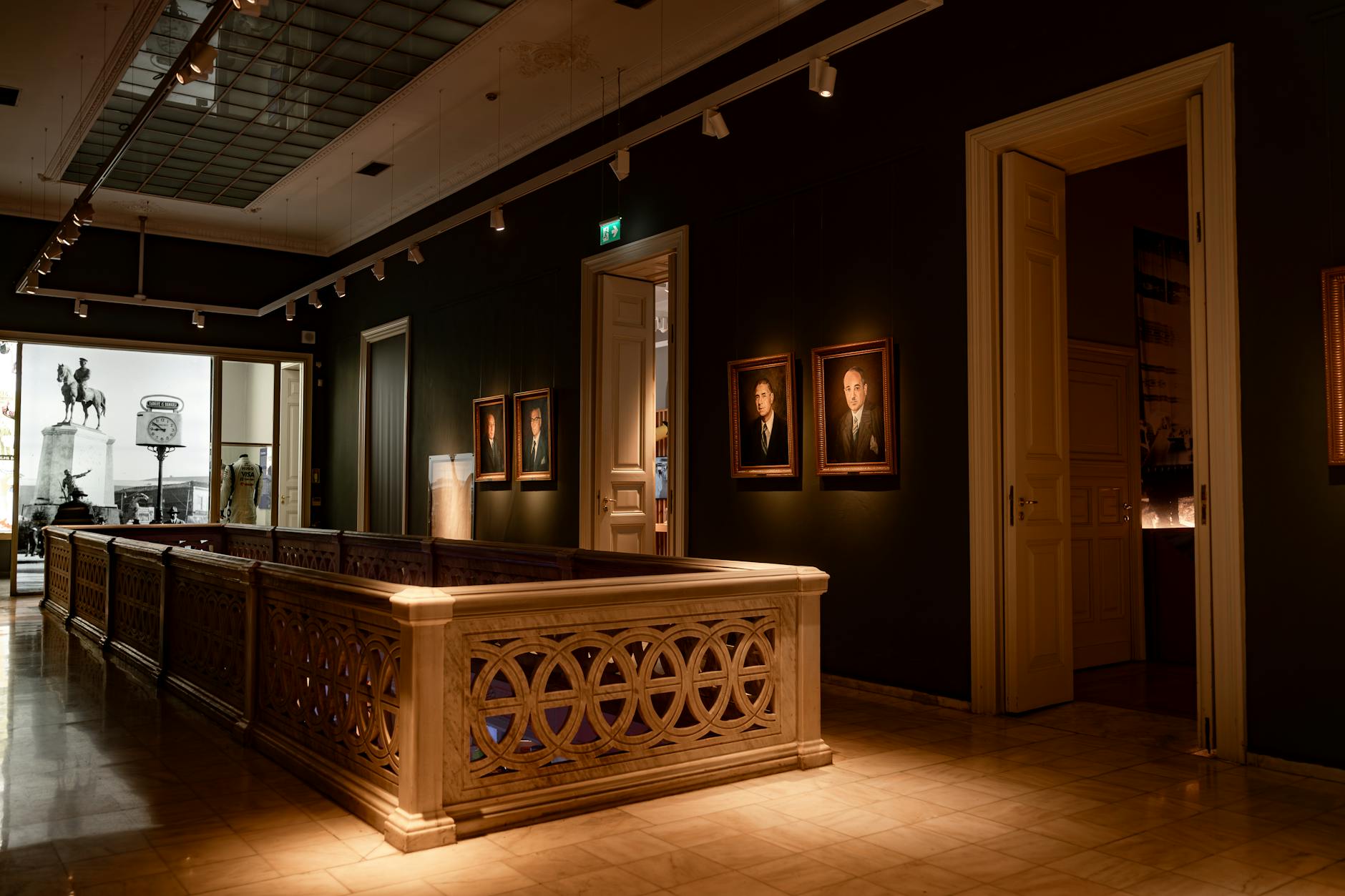 Classical fine-art museum interior with paintings and sculpture