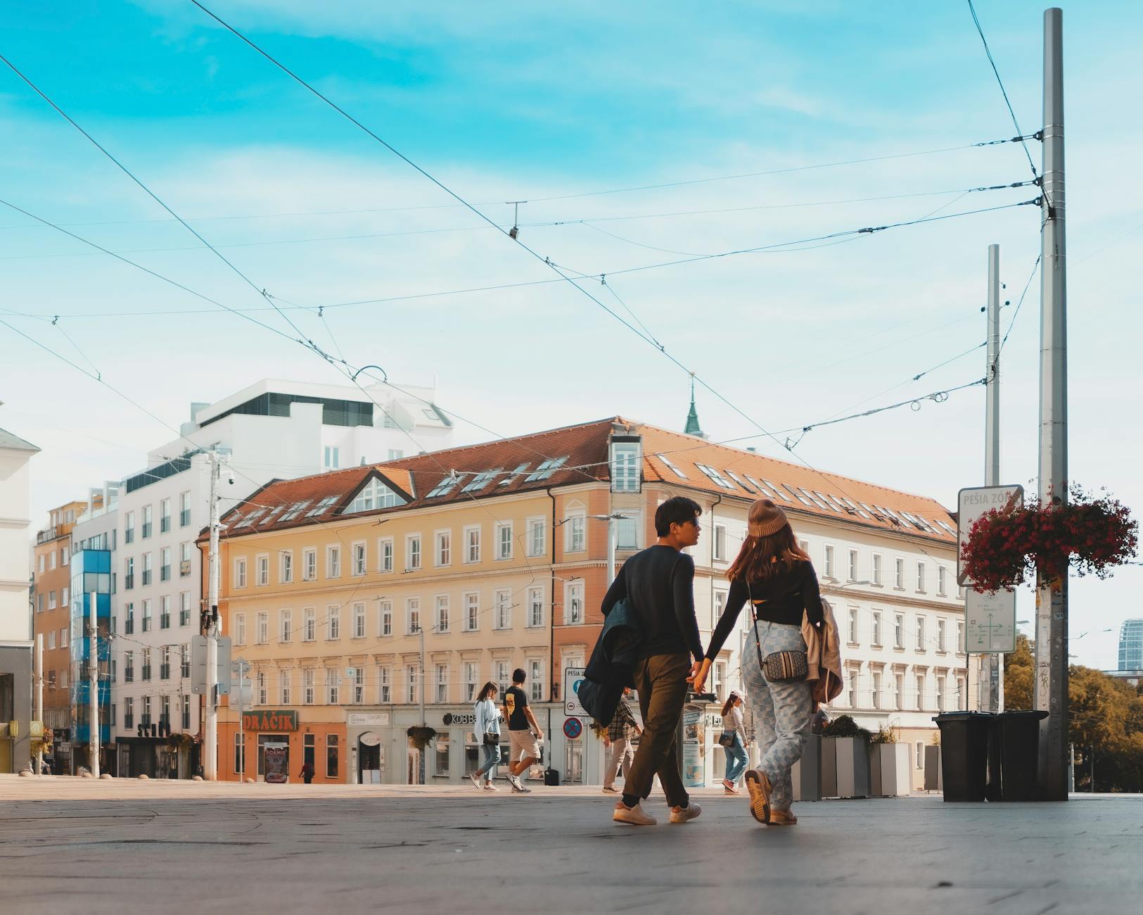 Romantic things to do in Stockholm — couple walking together along the harbor