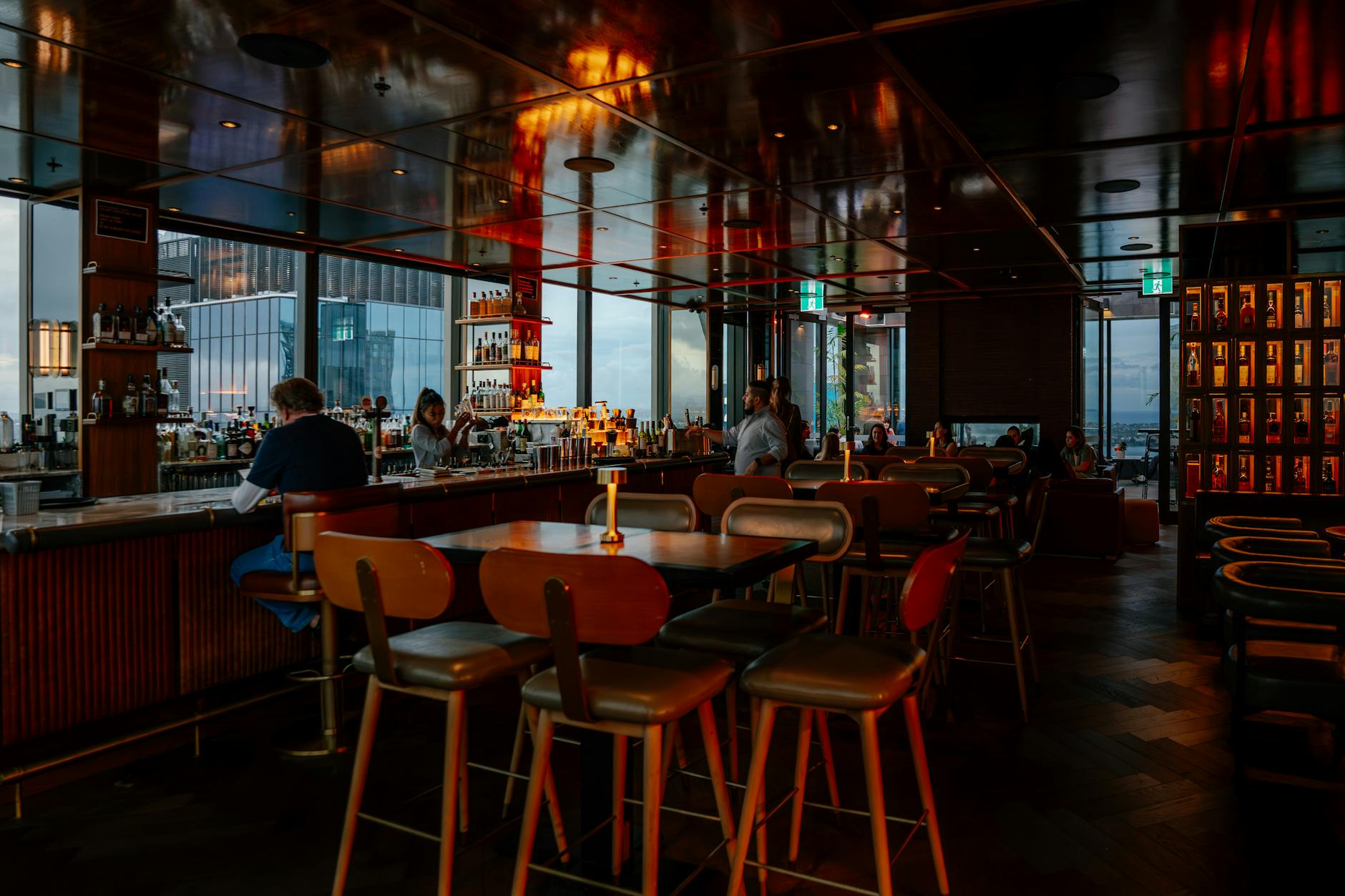 Stockholm hotel rooftop bar at sunset with panoramic city view