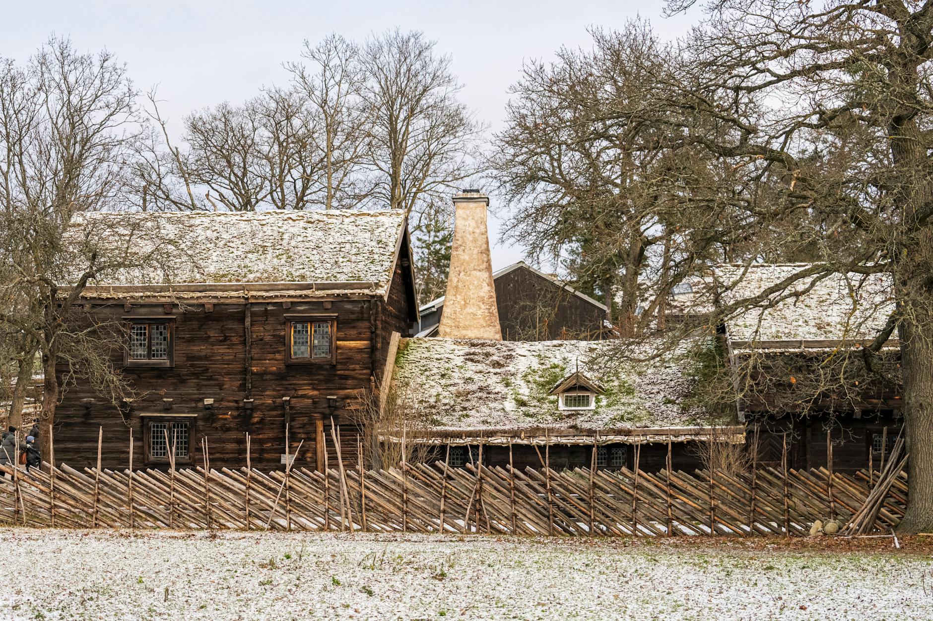 Traditional red-painted wooden Swedish cottage with white trim at Skansen open-air museum in Stockholm
