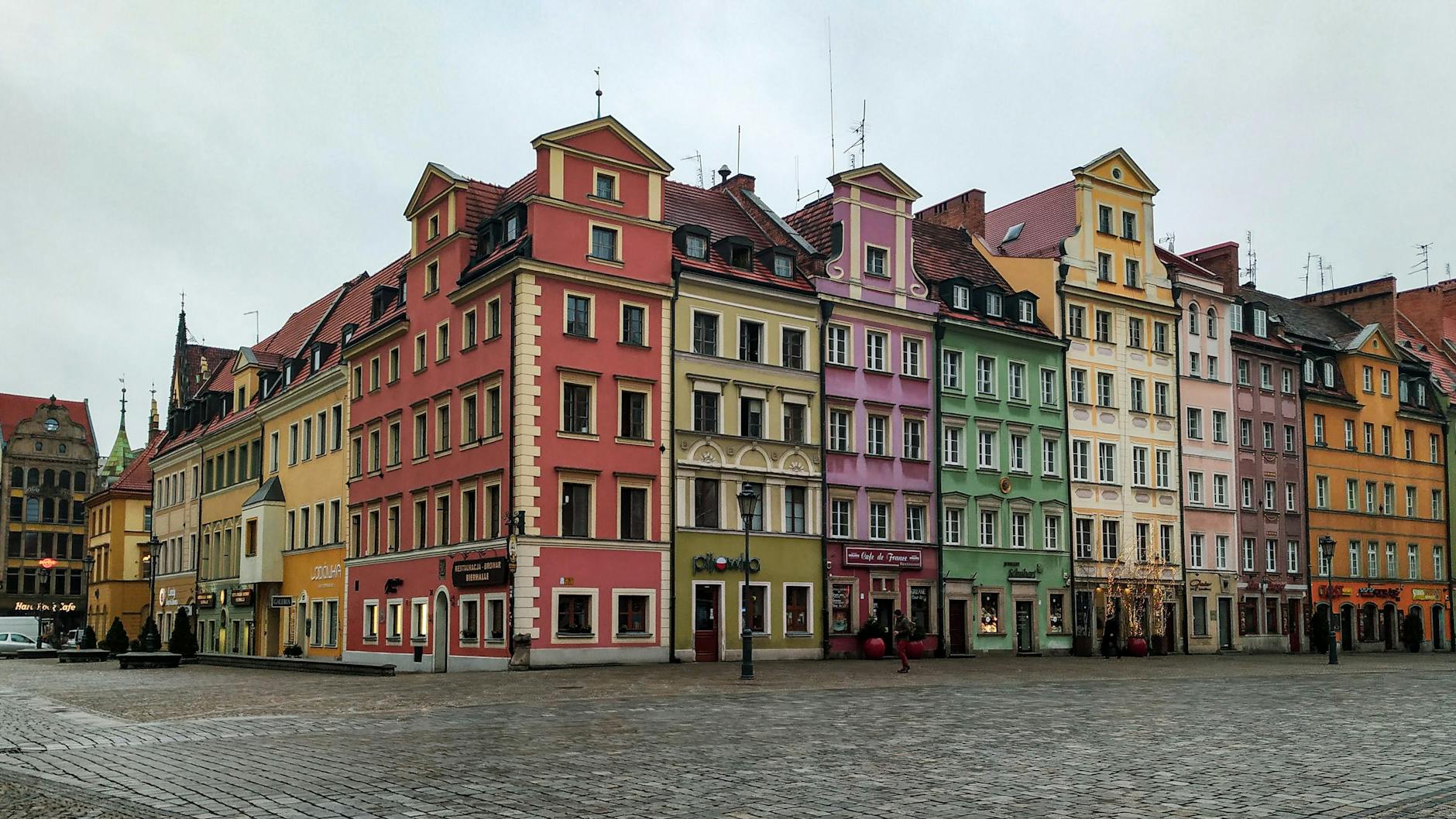 Old town colorful European buildings on cobblestone street