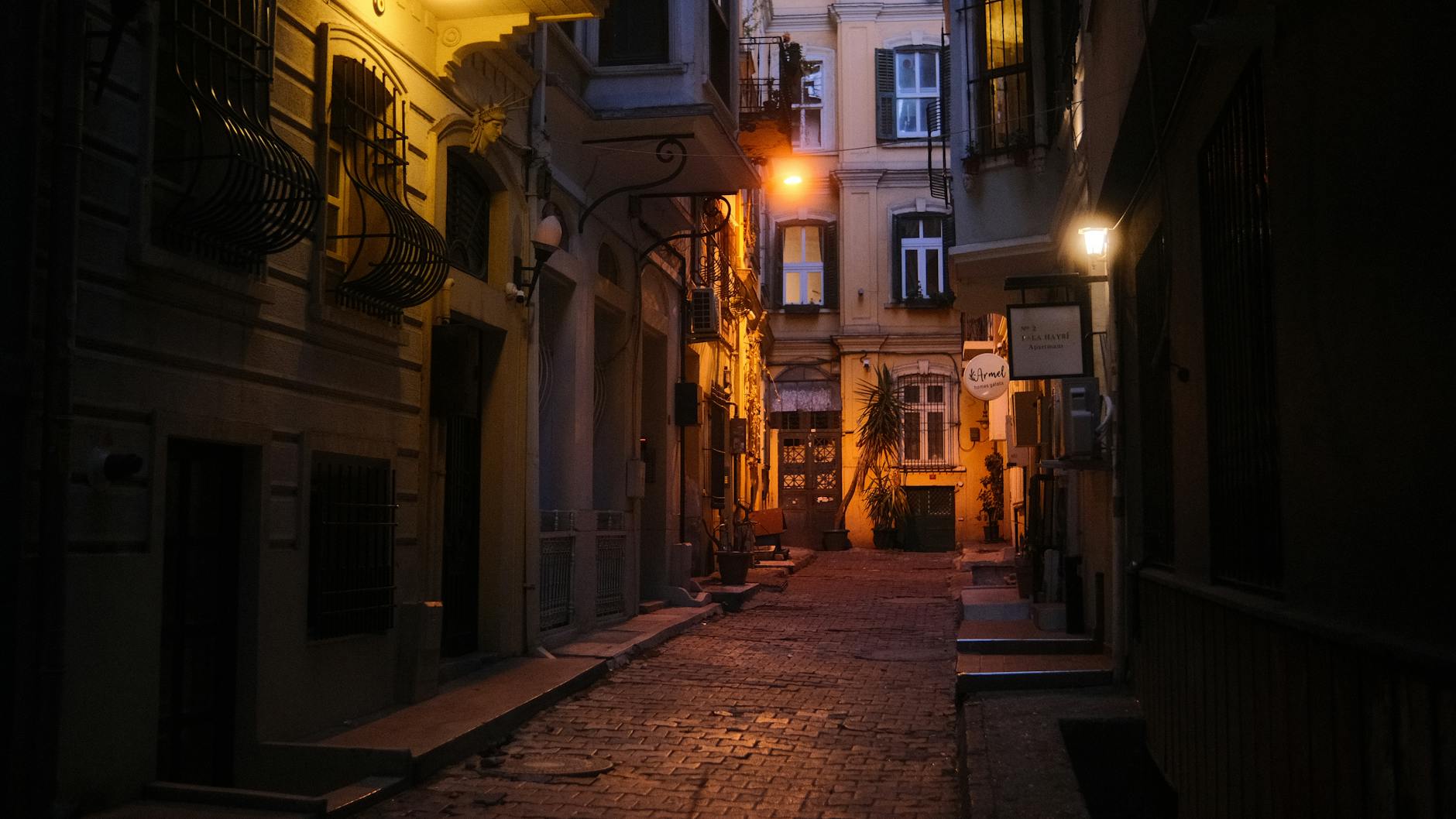 European city street at night with warm lights