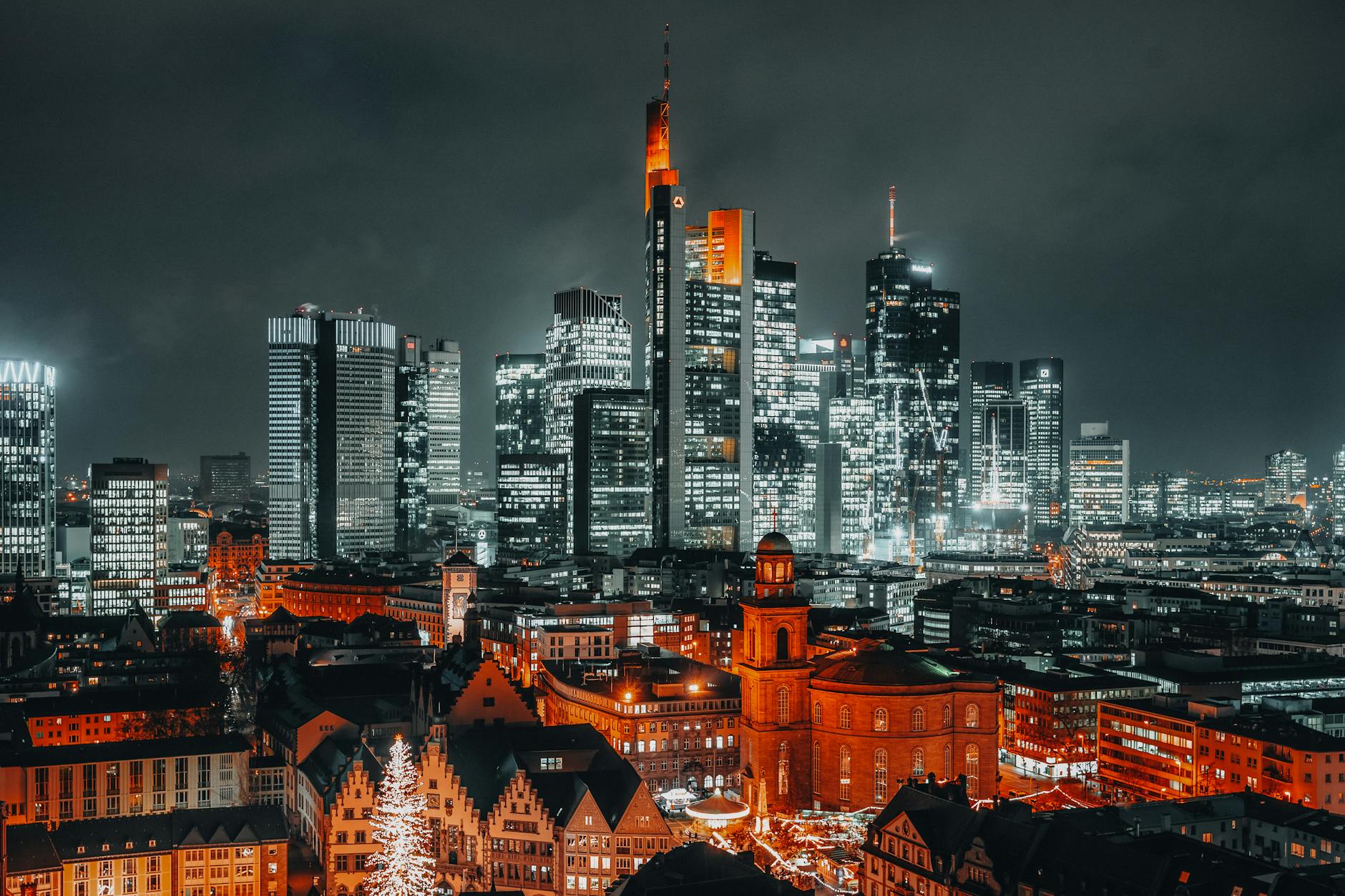 Scandinavian city at night with lights reflecting on water