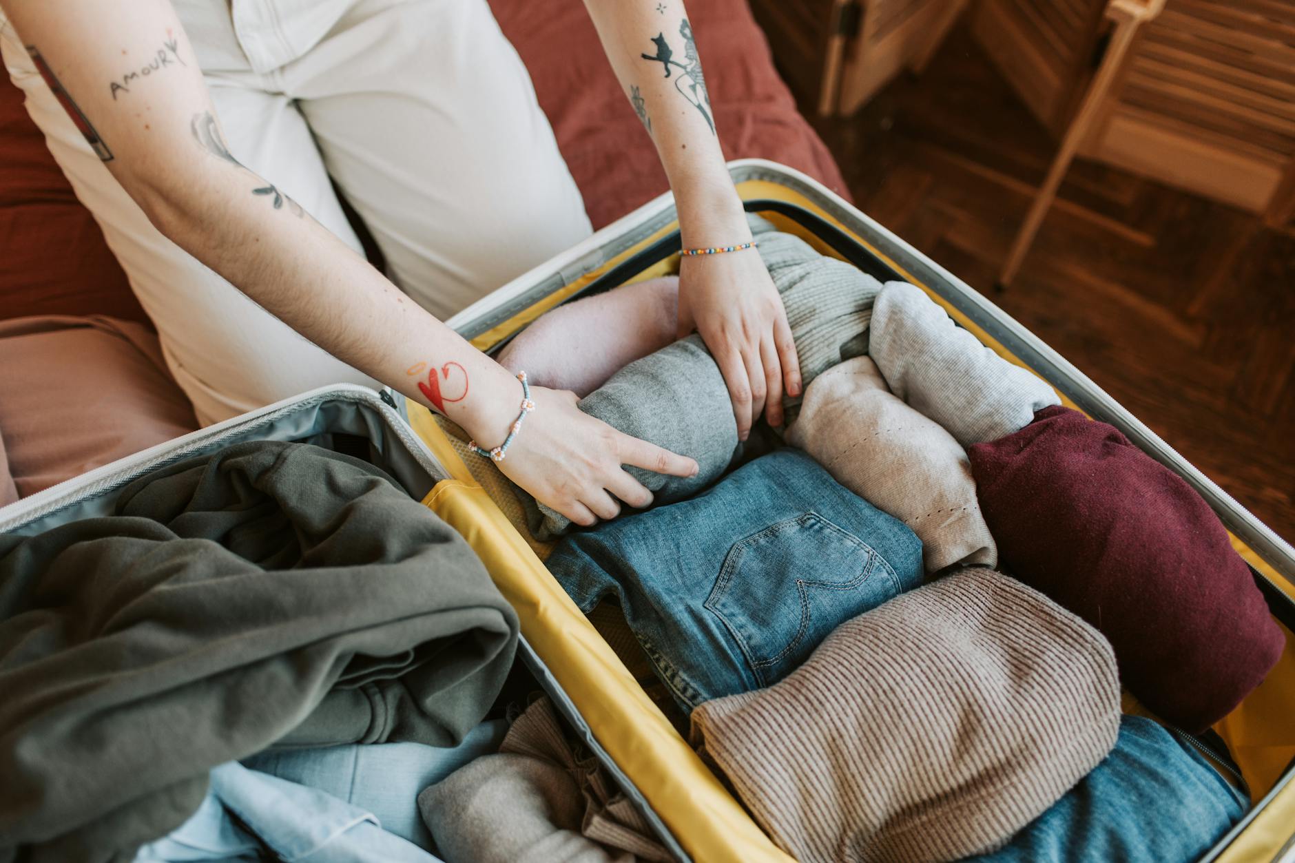 Stockholm packing list — open suitcase with folded clothes