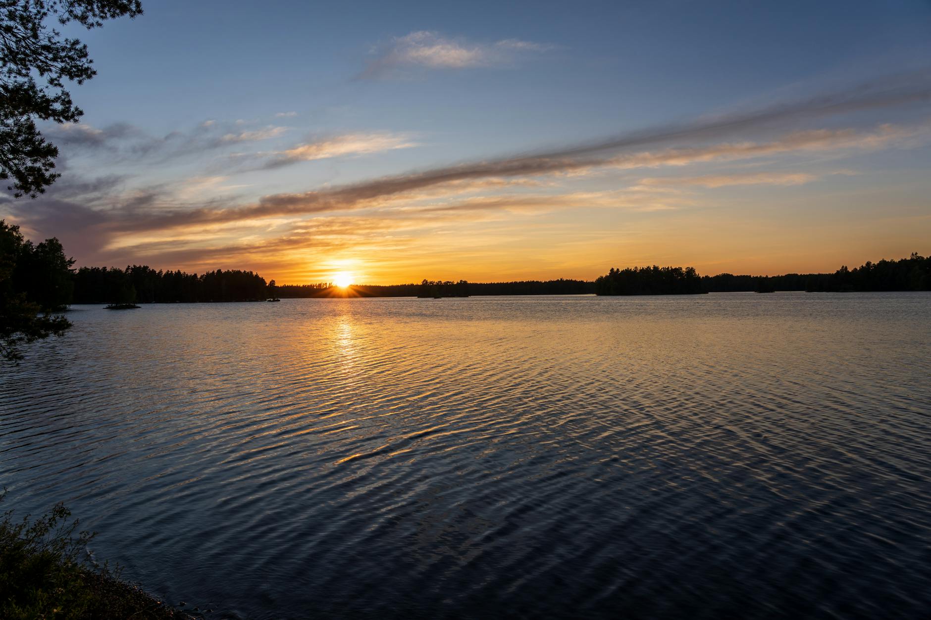 Scandinavian summer sunset over water and islands