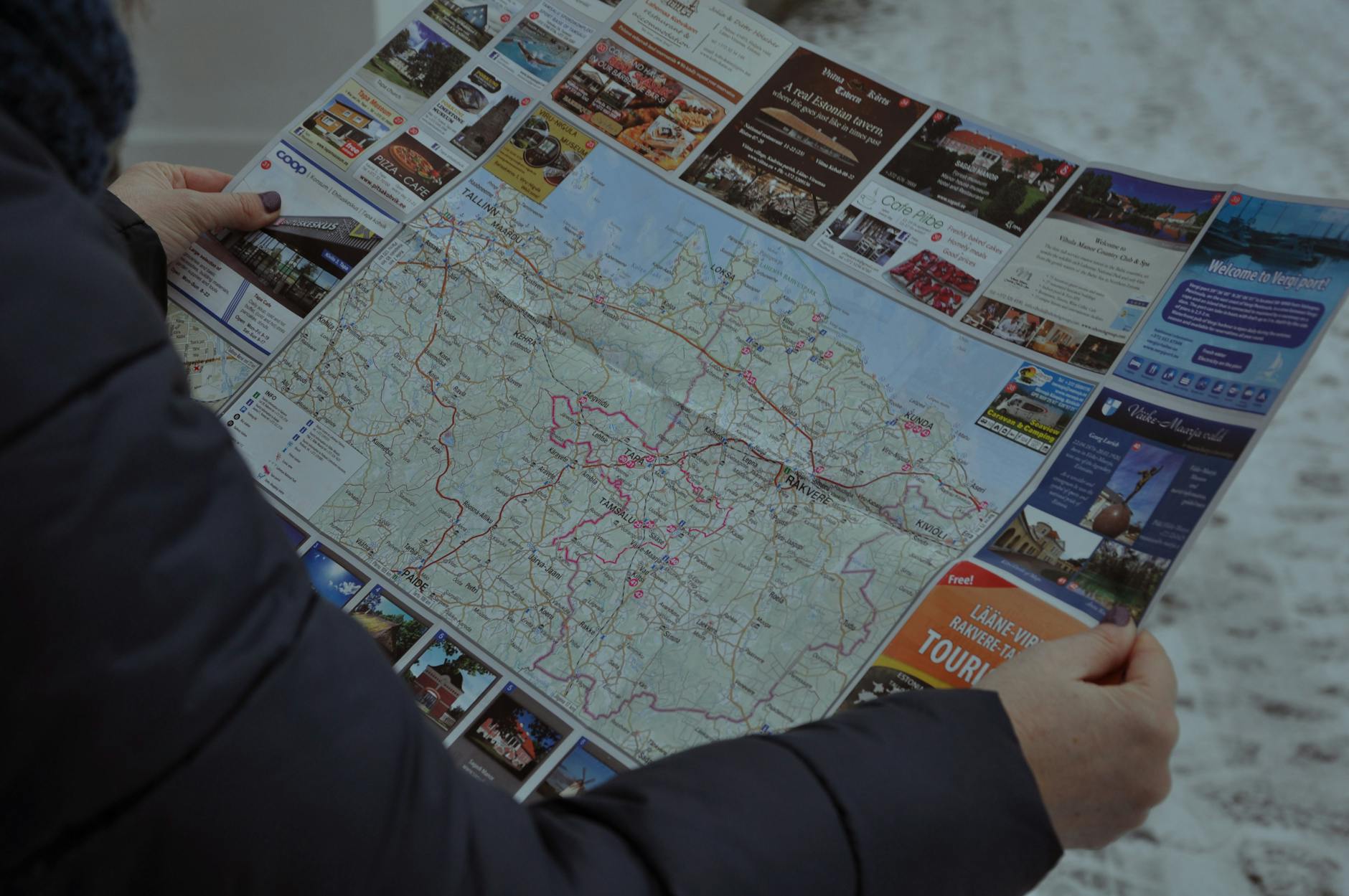 Tourist map of European city with travel pin and notebook