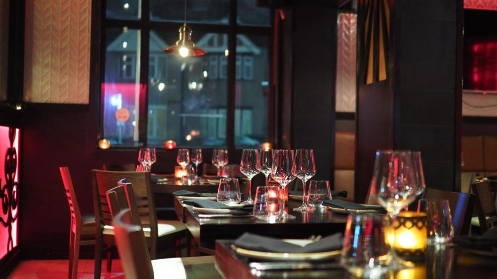 Warm restaurant interior in Stockholm set for dinner service