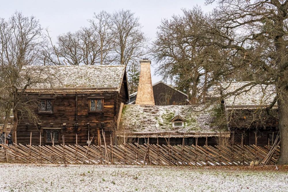 Djurgården guide — historic wooden buildings at Skansen open-air museum