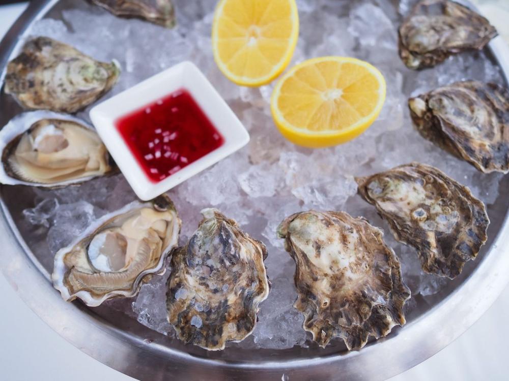 Fresh shellfish served on ice with lemon, a staple of Stockholm seafood bars