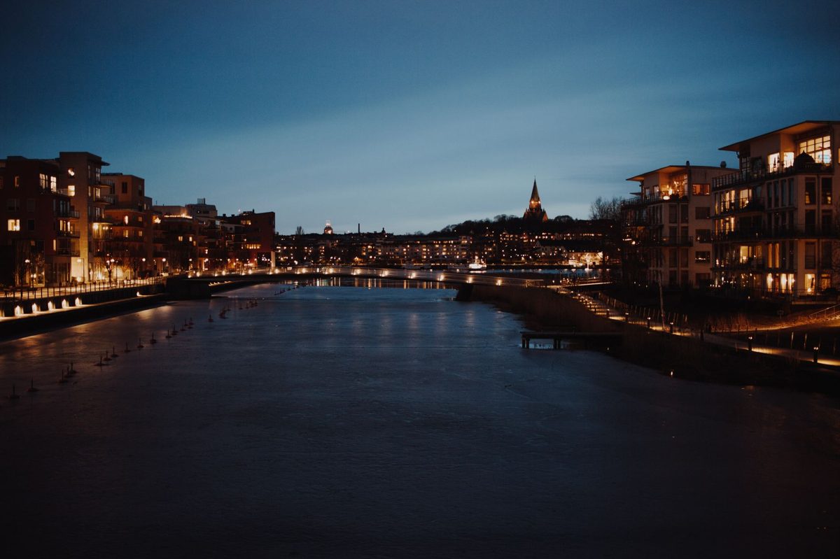Rooftop bar terrace at night overlooking the Stockholm nightlife skyline