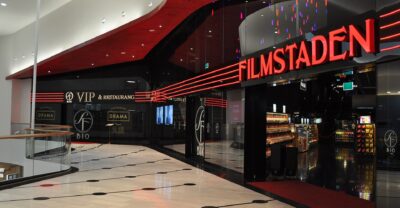 The Filmstaden cinema entrance inside Mall of Scandinavia, with red neon signage