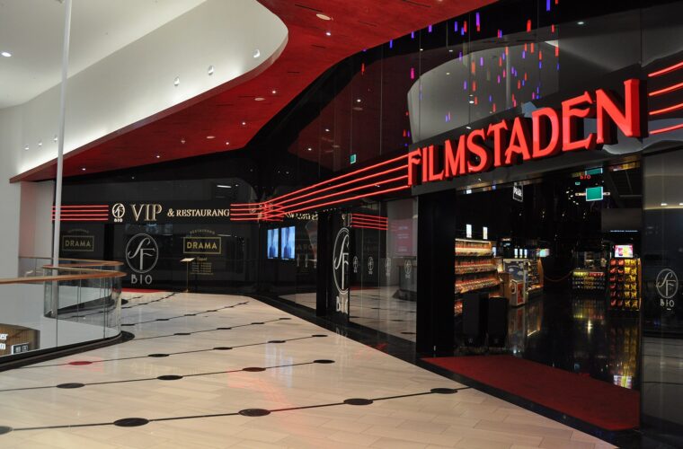 The Filmstaden cinema entrance inside Mall of Scandinavia, with red neon signage