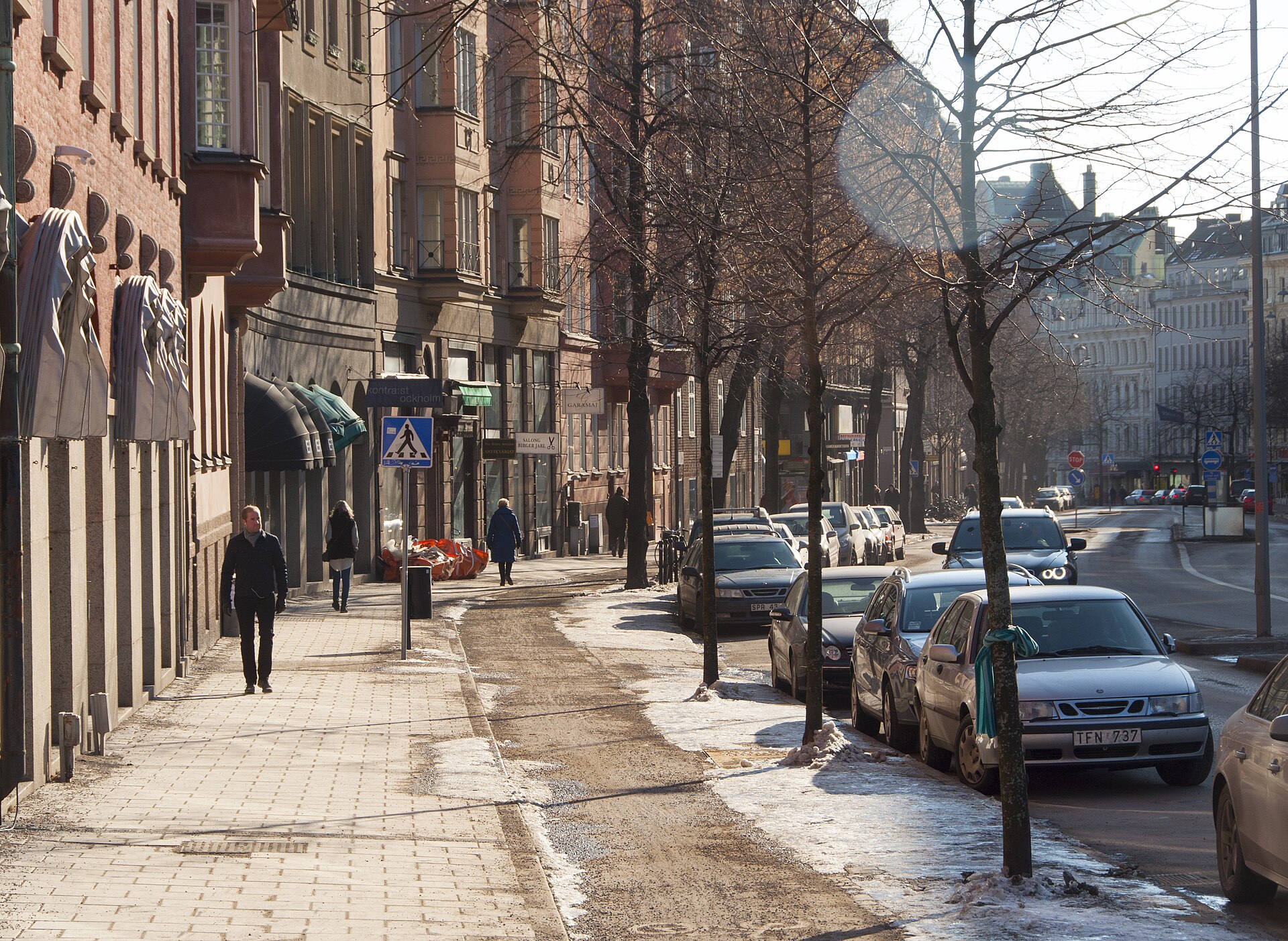 Pavement and shopfronts along Birger Jarlsgatan in Stockholm on a cold bright day