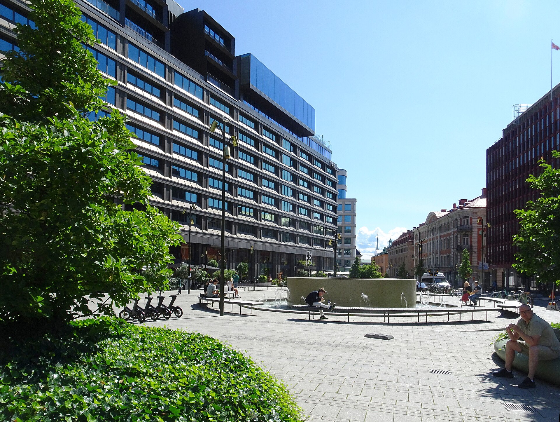 Brunkebergstorg square in Stockholm with a fountain, trees and the modernist hotel block behind
